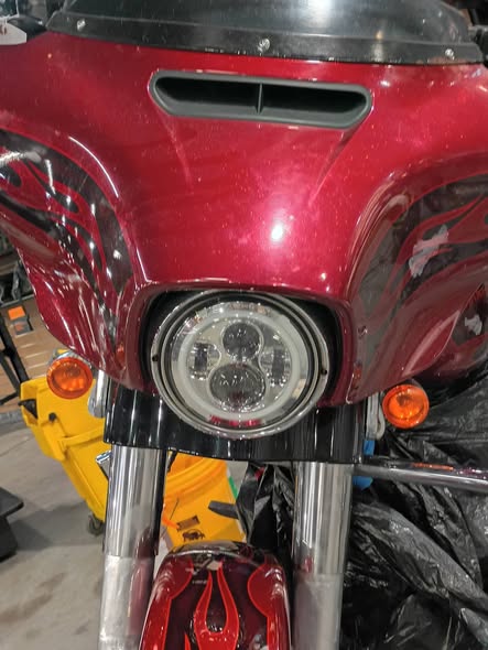 Red Harley-Davidson fairing and headlight after motorcycle paint correction